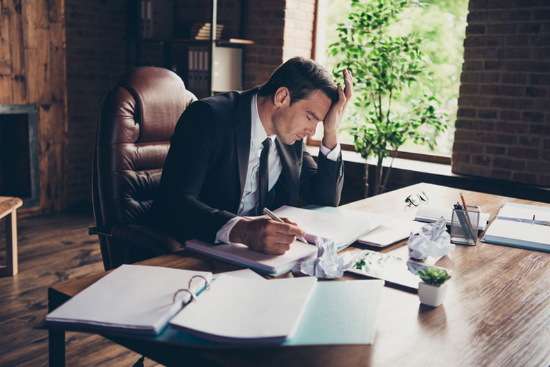 stressed lawyer at desk